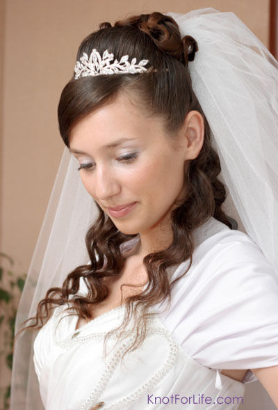 Half updo hairstyle with veil and tiara