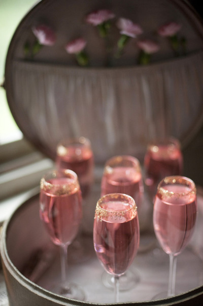 Pink Champagne in Gold Rimmed glasses for a Pink and Gold Wedding Theme